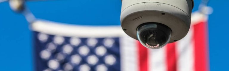 American Flag with a security camera in front of it