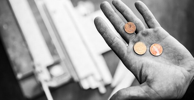 coins in a person's hand, austerity, money scarcity