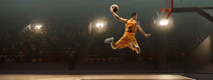 basketball player executing a slam dunk